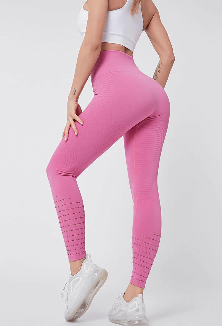 Pink high-waisted seamless leggings for women, featuring booty-lifting design and breathable fabric, ideal for fitness and exercise.
